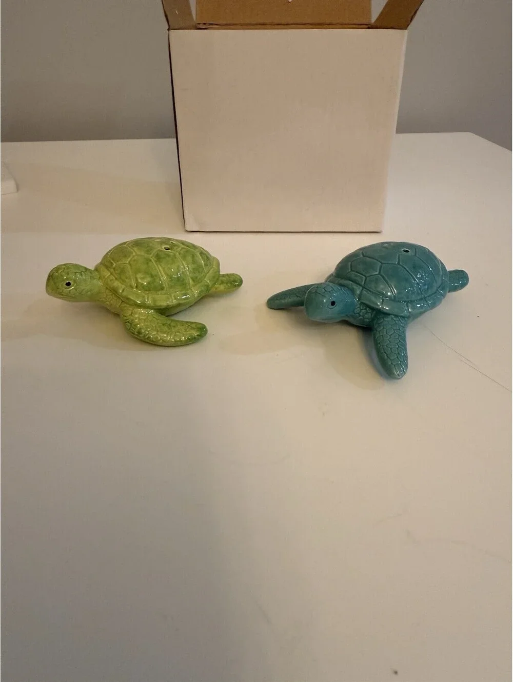 Cape Shore add a touch of ocean charm to your dining experience with the cape shore ceramic turtles salt & pepper set  colored in serene blue and green